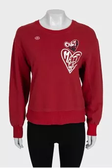 Red straight-cut sweatshirt with a print