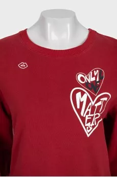 Red straight-cut sweatshirt with a print