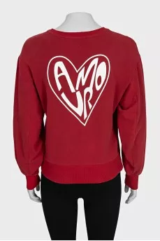 Red straight-cut sweatshirt with a print