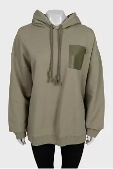 Green hoodie with a patch pocket