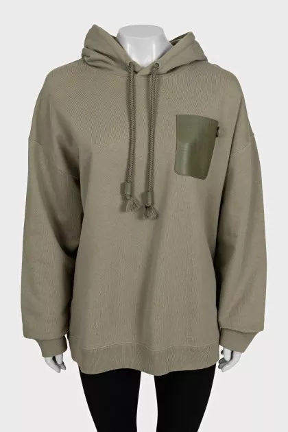 Green hoodie with a patch pocket