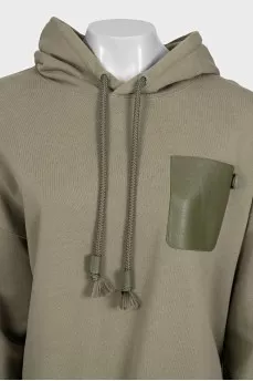 Green hoodie with a patch pocket
