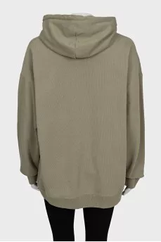 Green hoodie with a patch pocket