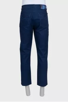 Men's blue trousers with a silver logo