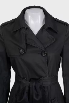 Dark green fitted trench coat with belt