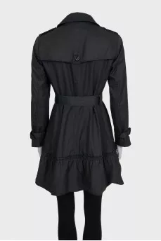 Dark green fitted trench coat with belt