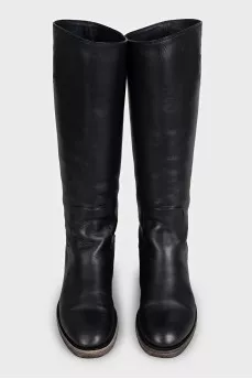 Black leather boots with brand logo