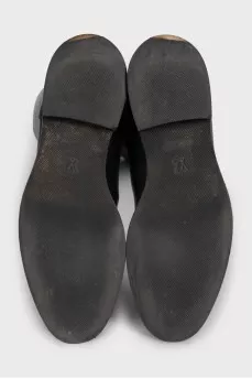 Black leather boots with brand logo