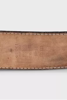 Black leather belt with embossed signature monogram