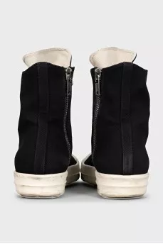 Black high-top sneakers with a zipper and laces