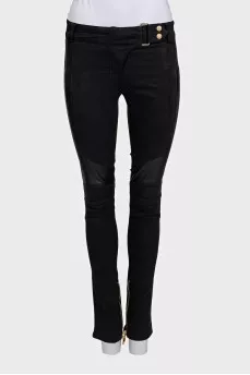 Black trousers with perforations