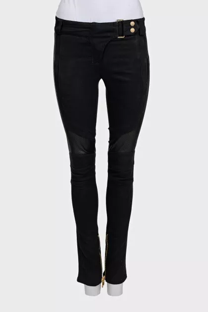 Black trousers with perforations