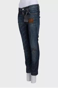 Темно-сині джинси з ефектом потертості