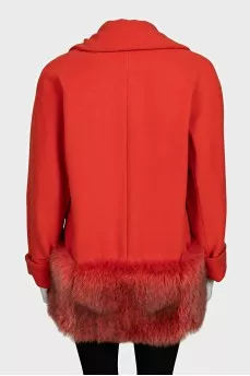 Orange coat decorated with fur