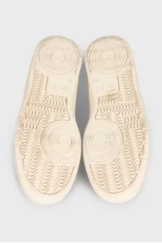 White leather sneakers with tag
