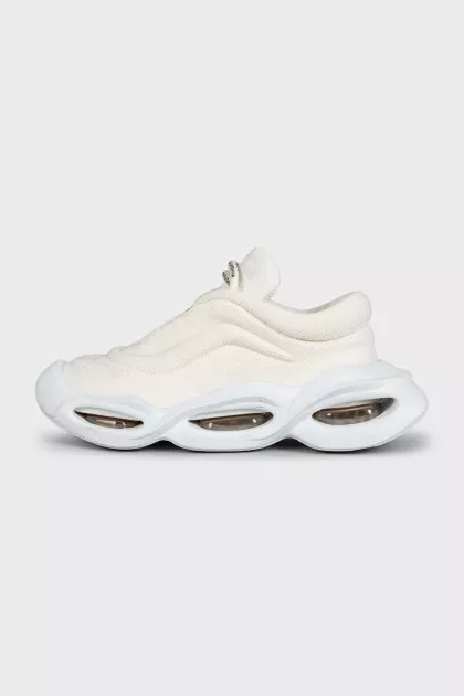 White textile sneakers with a shaped sole