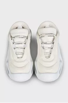 White textile sneakers with a shaped sole