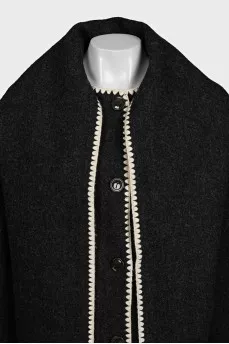 Straight-cut coat decorated with fringe