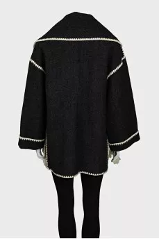 Straight-cut coat decorated with fringe