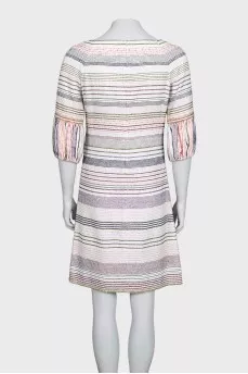 A straight-cut dress decorated with chains