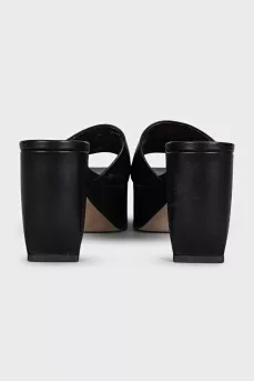 Black leather mules with a shaped heel