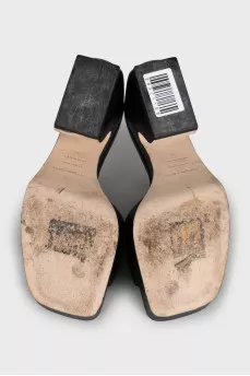 Black leather mules with a shaped heel