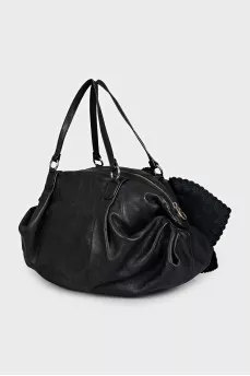 Black leather bag with a bow