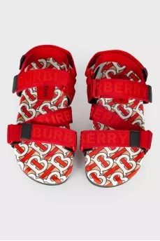 Children's red sandals with a tag