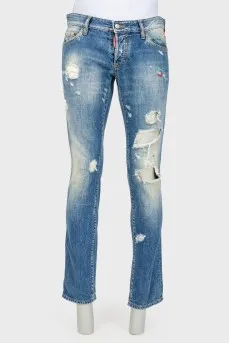 Male jeans with the effect of torn and shabby
