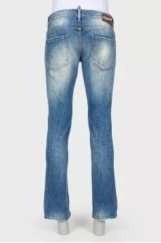 Male jeans with the effect of torn and shabby
