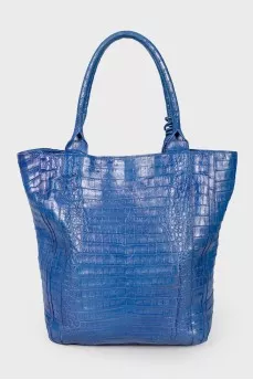 Blue bag with feather accessory
