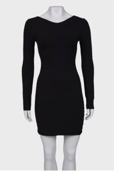 Black dress close-fitting in the waist