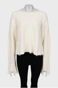 Knitted sweater with ripped effect