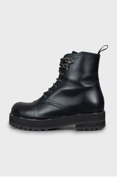 Black leather boots with brand logo