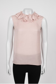 Beige tank top decorated with frills
