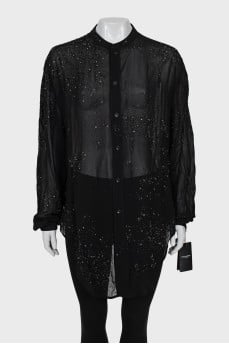 Black blouse decorated with rhinestones