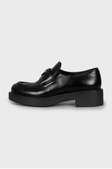Leather loafers with metal decor
