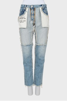 Jeans with inscription on pocket with tag