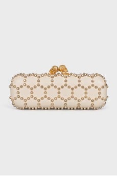Leather clutch with golden skulls