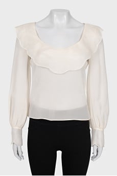 White blouse with a figured collar