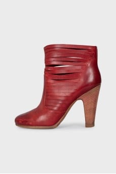 Red leather ankle boots with perforation
