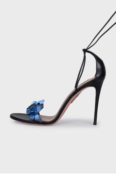 Leather sandals decorated with butterflies