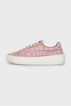Pink sneakers with a signature print