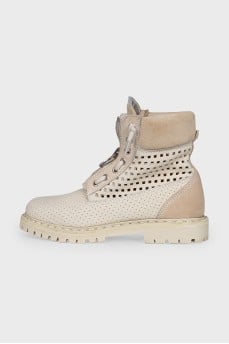 Leather lace-up boots with perforations