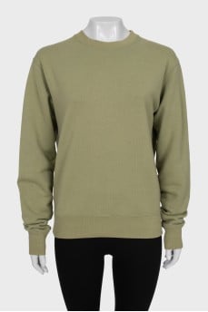 Green sweatshirt with a signature print
