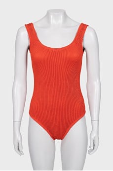One-piece swimsuit with open back and tag
