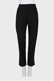 Tapered trousers with zippers at the bottom
