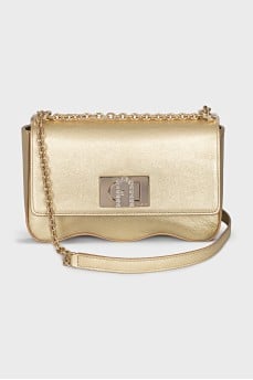 A gold leather bag decorated with crystals