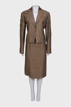 Suit consisting of a jacket with decor and a skirt