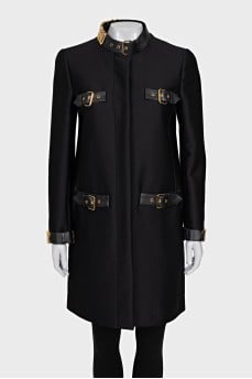 The black coat is decorated with a golden logo.